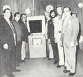 Crew from PMC Electroncis and others centering around their game Wham Bam. (1973)
